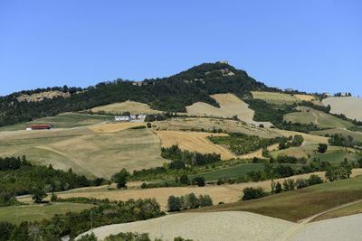Scenic view of landscape against clear blue sky
