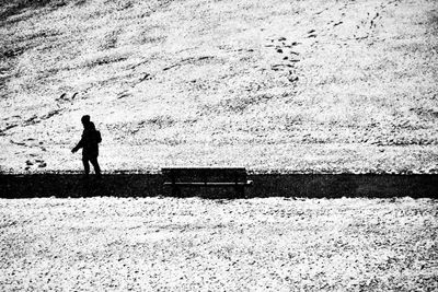 Silhouette woman standing on field