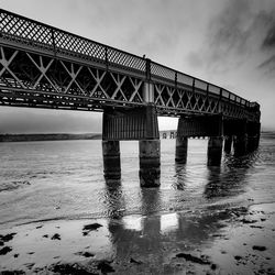 Low angle view of bridge over sea