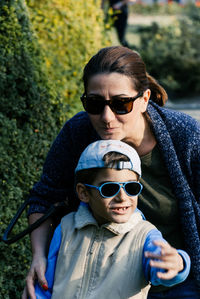 Portrait of father and son wearing sunglasses