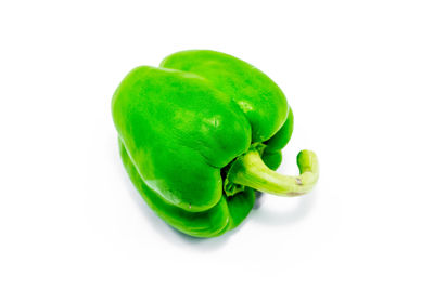 Close-up of green bell pepper against white background