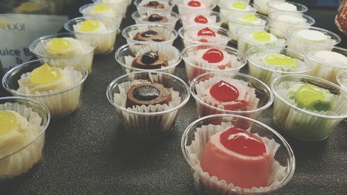 Close-up of dessert in bowls at market