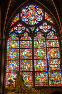 Low angle view of stained glass window in temple