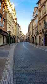 Road amidst buildings in city