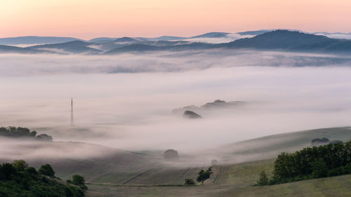 Scenic view of mountains against sky during sunset