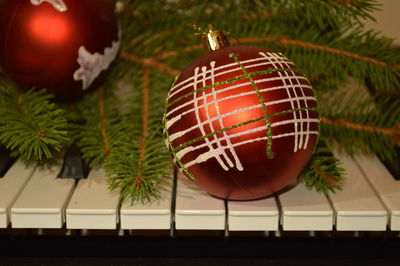 Close-up of christmas decoration on piano