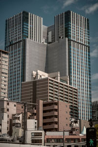 Low angle view of skyscrapers against sky