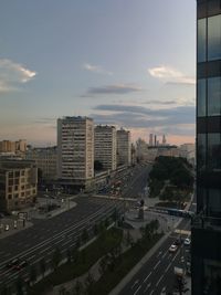 High angle view of city street against sky during sunset