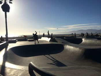 People skateboarding at skate park