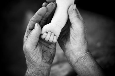 Youth and old age. hands of grandmother and granddaughter. high quality photo