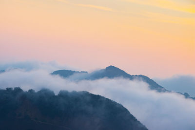 Low angle view of mountain against sky during sunset