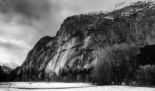 Scenic view of snow covered land against sky