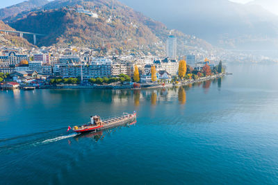 Scenic view of sea and buildings in city