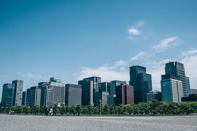 Buildings in city against sky