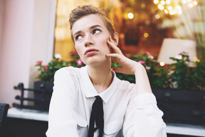 Portrait of young man sitting outdoors