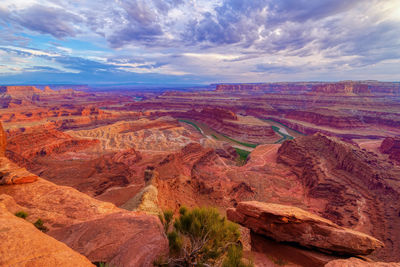 Aerial view of landscape against cloudy sky