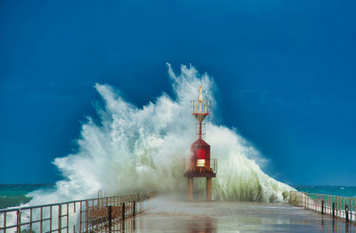 Wave breaking on the lighthouse.