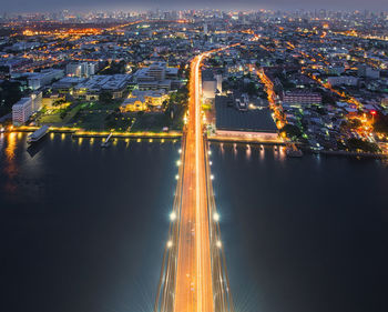 High angle view of light trails on road at night