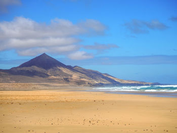 Scenic view of beach against sky