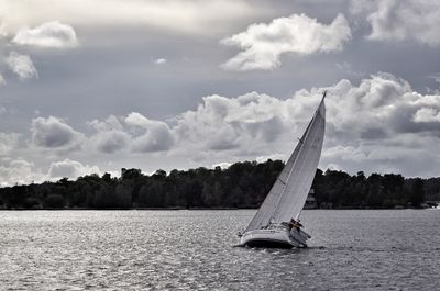 View of sailboat sailing on sea against sky