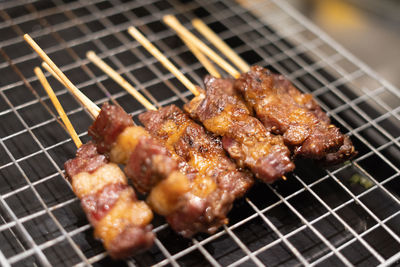 Close-up of meat on barbecue grill