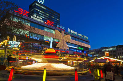 Illuminated amusement park at night