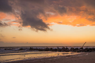 Scenic view of beach during sunset