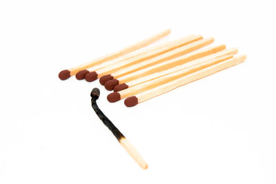 Close-up of fork over white background