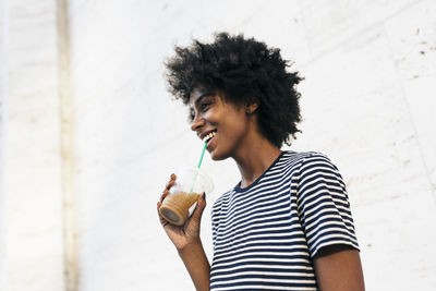 Portrait of smiling woman with drink