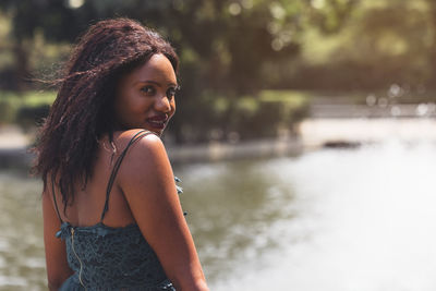 Portrait of young woman standing outdoors