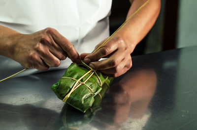 Midsection of man preparing food