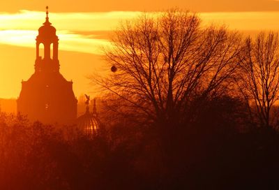 Silhouette of building at sunset