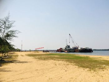 Scenic view of beach against clear sky