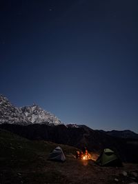 High angle view of illuminated tent against sky at night