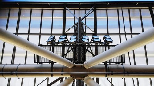 Low angle view of floodlight against sky