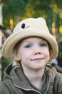 Portrait of young woman wearing hat