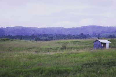 House on field against sky