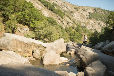 Full length of man standing on rock