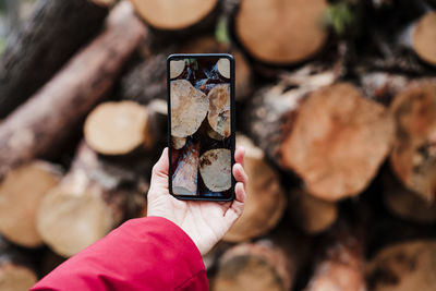 Close-up of hand holding mobile phone