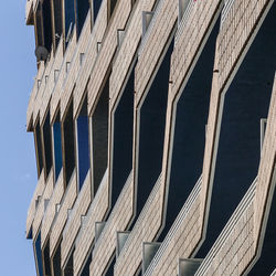 Low angle view of roof against blue sky