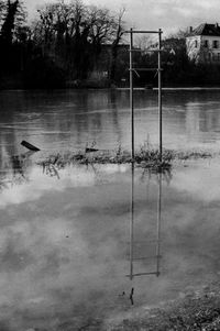 Ducks swimming on lake against sky