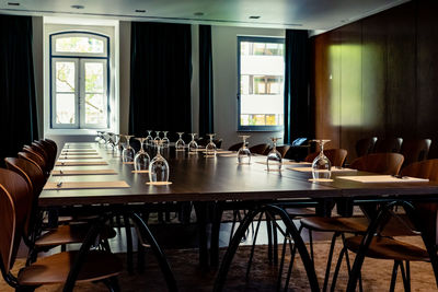 Empty chairs and tables in restaurant