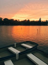 Scenic view of lake against orange sky