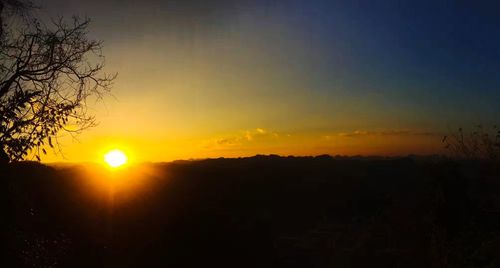 Scenic view of silhouette landscape against sky during sunset