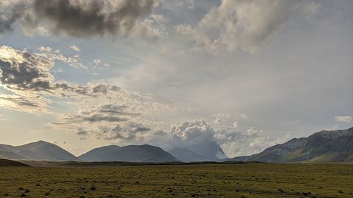 View of landscape against cloudy sky