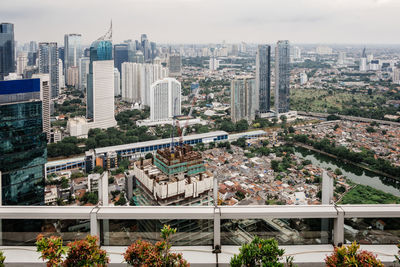 High angle view of modern buildings against sky