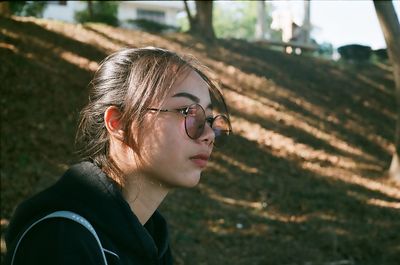 Portrait of young woman wearing eyeglasses