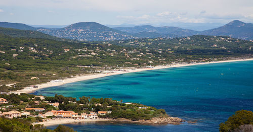 Aerial view of sea by mountains