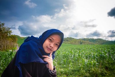Portrait of mature man on field against sky