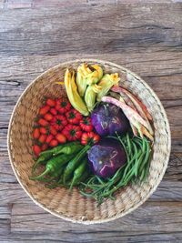 High angle view of vegetables in basket on table